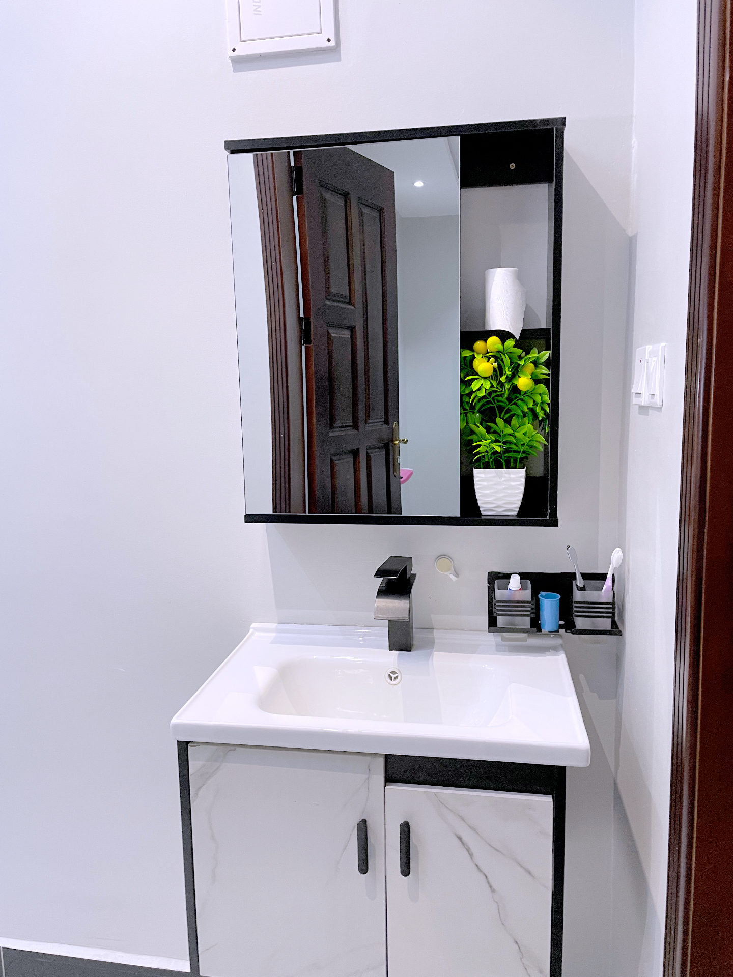 Modern bathroom vanity at SN Suites Apartments