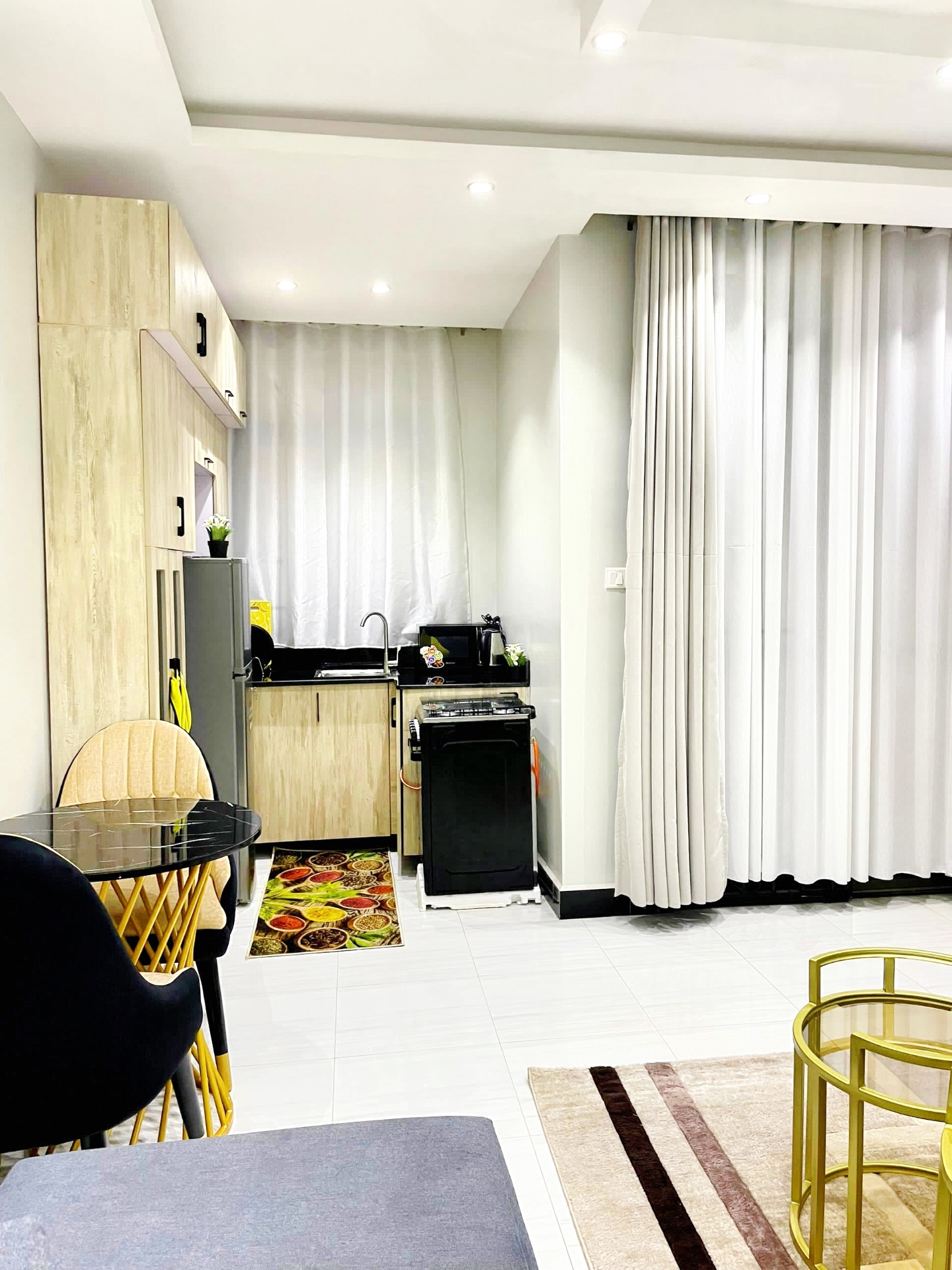 Open-plan interior at SN Suites Apartment with kitchen and lounge area